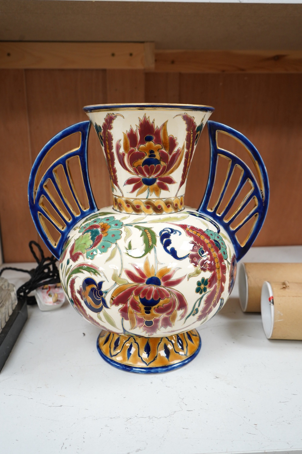 A large Hungarian Zsolnay two handled floral vase, 32cm high. Condition - fair, minor restoration